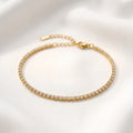 Gold bracelet with clear stones