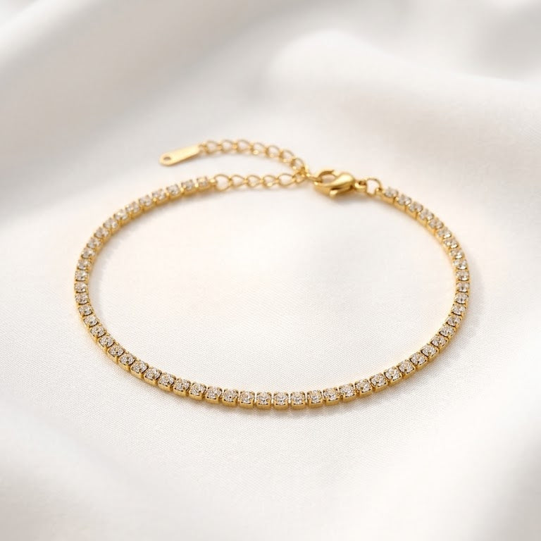 Gold bracelet with clear stones